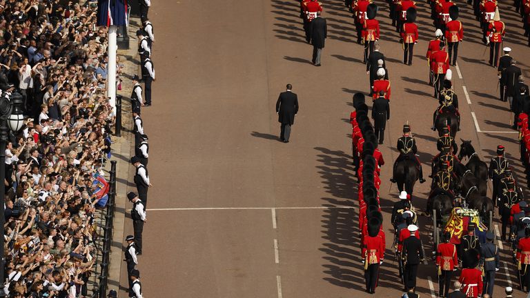 The coffin of Queen Elizabeth II, draped in the Royal Standard with the Imperial State Crown placed on top, is carried on a horse-drawn gun carriage of the King&#39;s Troop Royal Horse Artillery, during the ceremonial procession from Buckingham Palace to Westminster Hall, London, where it will lie in state ahead of her funeral on Monday. Picture date: Wednesday September 14, 2022.