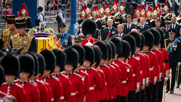 The Prince of Wales (centre left) and The Duke of Sussex (centre right) follow the coffin of Queen Elizabeth II, draped in the Royal Standard with the Imperial State Crown placed on top, carried on a horse-drawn gun carriage of the King&#39;s Troop Royal Horse Artillery, during the ceremonial procession from Buckingham Palace to Westminster Hall, London, where it will lie in state ahead of her funeral on Monday. Picture date: Wednesday September 14, 2022.