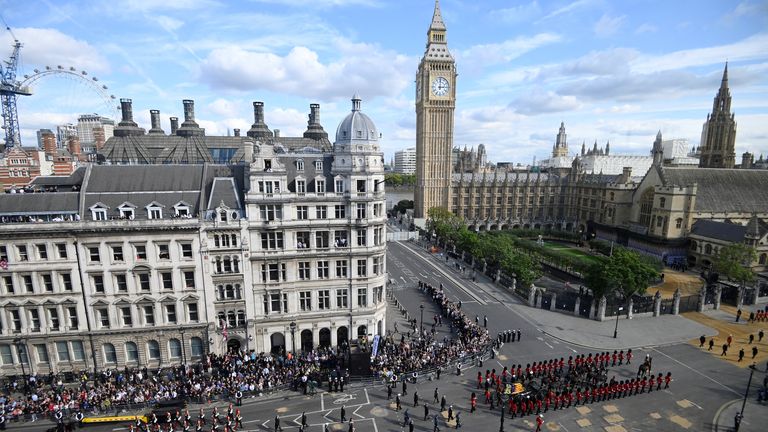 The coffin of Queen Elizabeth II, draped in the Royal Standard with the Imperial State Crown placed on top, is carried on a horse-drawn gun carriage of the King&#39;s Troop Royal Horse Artillery, during the ceremonial procession from Buckingham Palace to Westminster Hall, London, where it will lie in state ahead of her funeral on Monday. Picture date: Wednesday September 14, 2022.