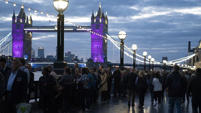 Members of the public in the queue at 06:04 on The Queen&#39;s Walk by Tower Bridge in London, as they wait to view Queen Elizabeth II lying in state ahead of her funeral on Monday. Picture date: Friday September 16, 2022.