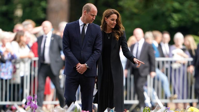 The Prince and Princess of Wales view floral tributes left by members of the public at the gates of Sandringham House in Norfolk, following the death of Queen Elizabeth II. Picture date: Thursday September 15, 2022.