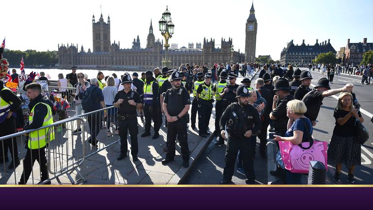 Police with members of the public who are waiting in line in central London, to view Queen Elizabeth II lying in state in Westminster Hall ahead of her funeral on Monday. Picture date: Wednesday September 14, 2022.