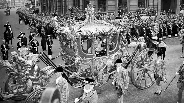 File photo dated 2/6/1953 of Queen Elizabeth II riding with the Duke of Edinburgh in the State Coach through Trafalgar Square on the way from Buckingham Palace to Westminster Abbey for her coronation. The Queen&#39;s coronation, rich in religious significance, was a morale boost for a nation starved of pageantry by the war, and for a day street parties banished the hardship of rationing and shortages and even atrocious, unseasonal weather did not dampen the enthusiasm. Issue date: Thursday September