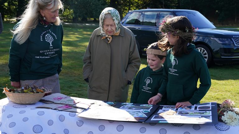 Queen Elizabeth II meets with schoolchildren before the start of the official planting season for the Queen&#39;s Green Canopy