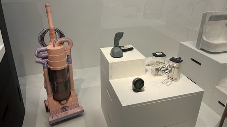 The Queen has seen a massive technological change, including this vacuum cleaner designed by James Dyson in 1986 and a Kenwood electric food mixer from the 60s