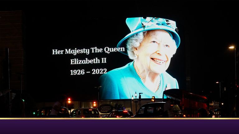 An advertising hoarding in Piccadilly Circus, in London, displays a sign marking the death of Queen Elizabeth II. Pic: AP