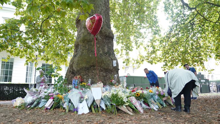 Flowers and tributes laid by members of the public in Green Park, London, following the death of Queen Elizabeth II. The Queen&#39;s coffin will be transported on a six-hour journey from Balmoral to the Palace of Holyroodhouse in Edinburgh, where it will lie at rest. Picture date: Sunday September 11, 2022.

