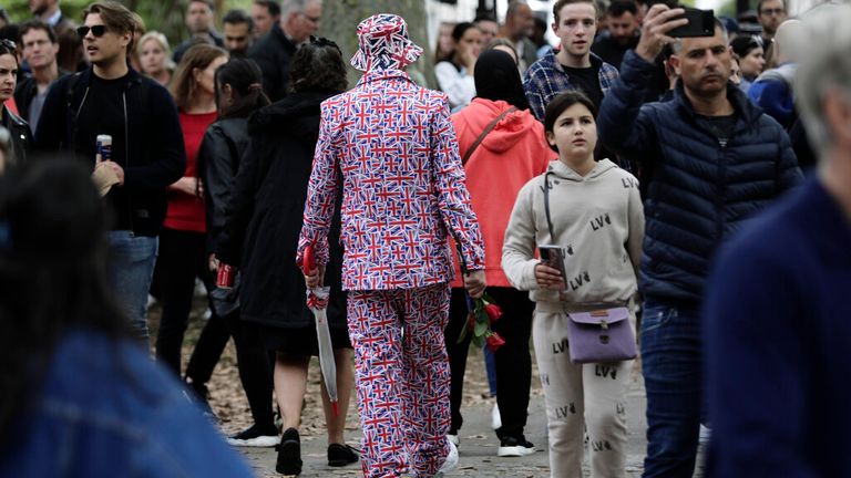 Not content with wearing a suit completely covered in Union Jacks, one mourner decided he would find a hat to match 