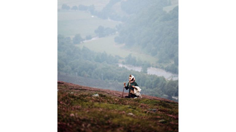 The royal family released a never-before-seen picture of the Queen hiking in moorland. Pic: Lichfield 