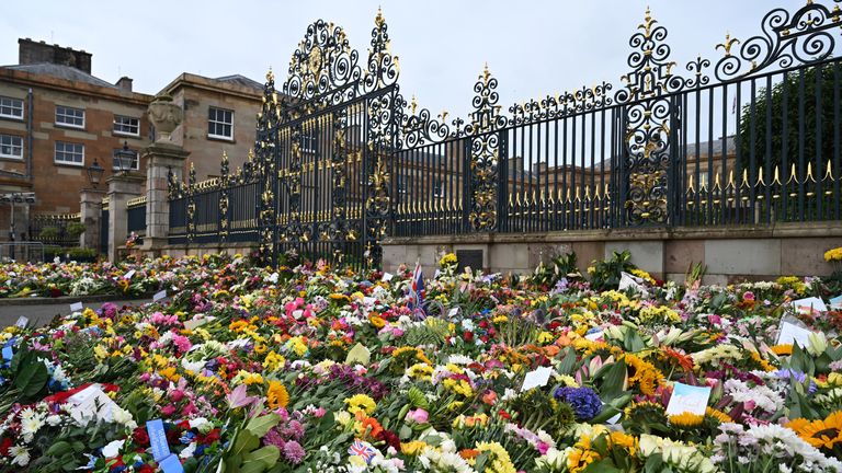 Flowers and tributes have been laid outside Hillsborough Castle after the death of the Queen