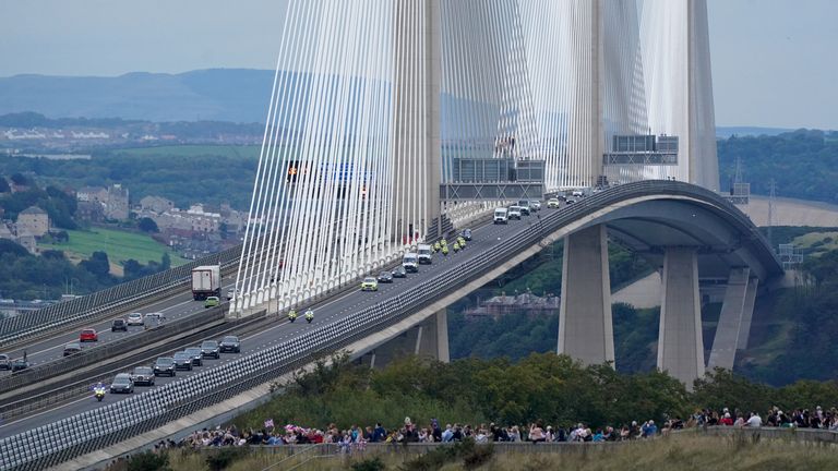 The hearse carrying the coffin of Queen Elizabeth II, draped with the Royal Standard of Scotland, passing over the Queensferry Crossing as it continues its journey to Edinburgh from Balmoral. Picture date: Sunday September 11, 2022.