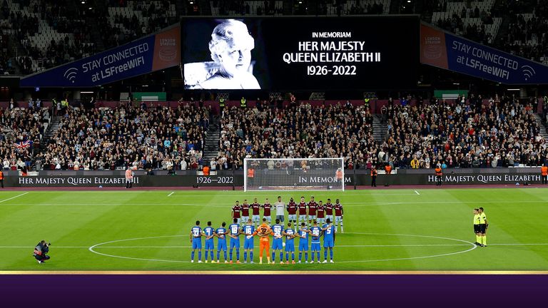 Players during a minutes silence before the match after the death of Queen  