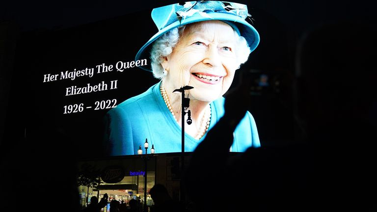 A tribute to Queen Elizabeth II is displayed on a big screen in Piccadilly Circus in central London
