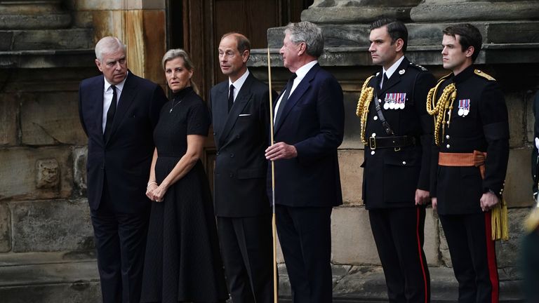 (far left to right) The Duke of York, the Countess of Wessex, and the Earl of Wessex (centre) await the arrival of the hearse carrying the coffin of Queen Elizabeth II, draped with the Royal Standard of Scotland, as it completes its journey from Balmoral to the Palace of Holyroodhouse in Edinburgh, where it will lie in rest for a day. Picture date: Sunday September 11, 2022.
