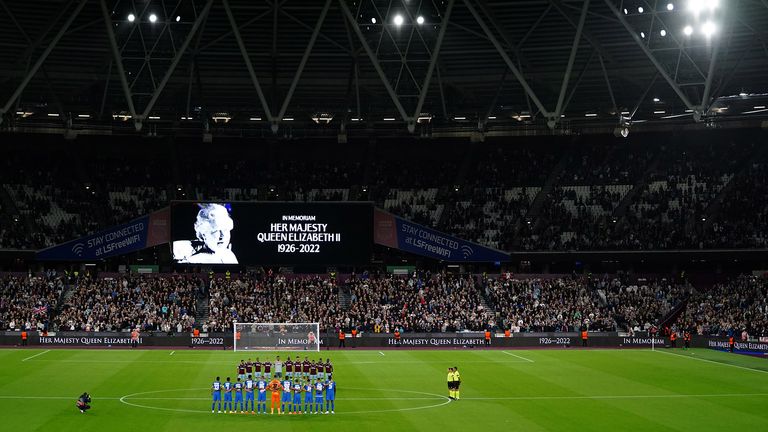 The players line up as the big screen displays a message in memoriam following the announcement of the death of Queen Elizabeth II, before the UEFA Europa Conference League Group B match at the London Stadium, London. Picture date: Thursday September 8, 2022.