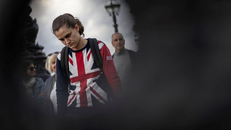 A woman stands in a queue to pay respect to Britain&#39;s Queen Elizabeth, following her death, in London, Britain September 15, 2022. REUTERS/Carlos Barria