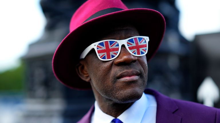 A man walks in a queue to pay his respect to the late Queen Elizabeth II during the lying-in-state, in Westminster Hall in London, Thursday, Sept. 15, 2022. The Queen will lie in state in Westminster Hall for four full days before her funeral on Monday Sept. 19.(AP Photo/Petr David Josek)