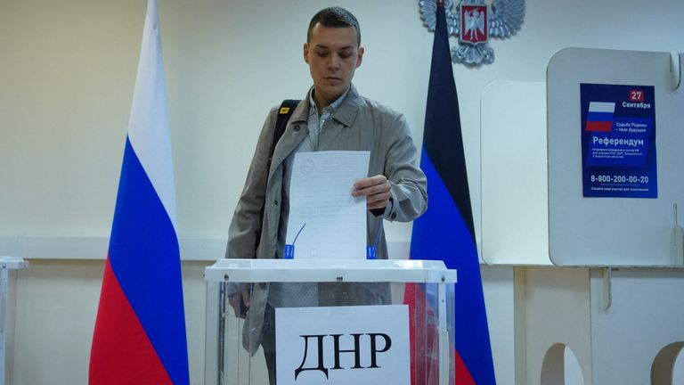 A man casts his ballot during the first day of a referendum on the joining of Russian-controlled regions of Ukraine to Russia, at a polling station in Moscow, Russia September 23, 2022. Voting takes place for residents of the self-proclaimed Donetsk (DPR) and Luhansk People&#39;s Republics (LPR) and Russian-controlled areas of the Kherson and Zaporizhzhia regions of Ukraine. Alexander Avilov/Moscow News Agency/Handout via REUTERS 