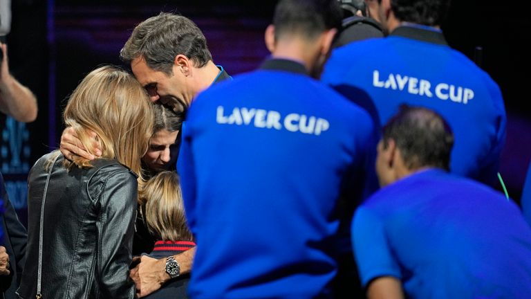 An emotional Roger Federer of Team Europe embraces his wife Mirka and their children after playing against Rafael Nadal in a Laver Cup doubles match against Team World's Jack Sock and Frances Tiafoe at the O2 arena in London, Friday , September 23, 2022. Federer's double loss against Nadal marked the end of an illustrious career that included 20 Grand Slam titles and tennis statesmanship.  (AP Photo / Kin Cheung)
