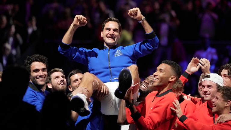 Team Europe's Roger Federer is lifted by fellow players after playing with Rafael Nadal in a Laver Cup doubles match against Team World's Jack Sock and Frances Tiafoe at the O2 arena in London, Friday, Sept. 23, 2022. Federer's losing doubles match with Nadal marked the end of an illustrious career that included 20 Grand Slam titles and a role as a statesman for tennis. (AP Photo/Kin Cheung)