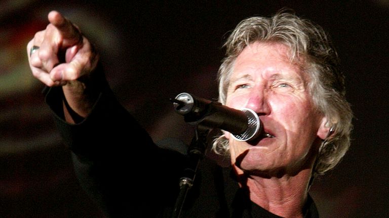 British rock musician and former member of the band "Pink Floyd" Roger Waters performs on stage in Wiesen, about 60 kilometres east of Vienna June 14, 2002. Waters who seperated from "Pink Floyd" in the mid of the eighties performs in Austria with his his "In the Flesh"-show and presents a comprehensive overview of his music including early "Pink Floyd"-material. REUTERS/Herwig Prammer REUTERS PR/