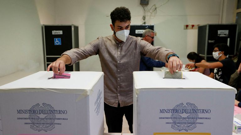 A man votes at a polling station during the snap election, in Rome, Italy, September 25