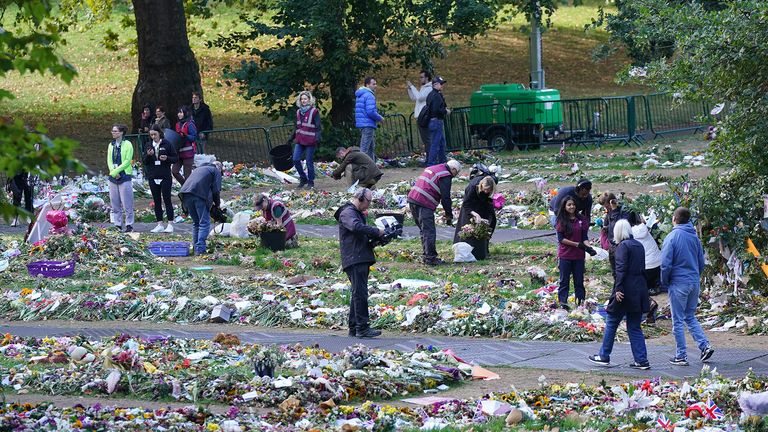Royal Parks staff and volunteers start removing floral tributes from Green Park in London to be taken to the Hyde Park nursery then composted in Kensington Gardens. The compost will then be used on landscaping projects and shubberies across the Royal Parks. Picture date: Monday September 26, 2022.