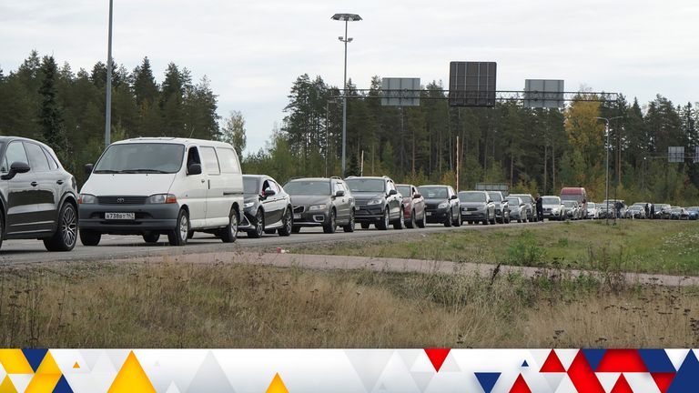 Cars in a queue as people wait to get into Finland from Russia
