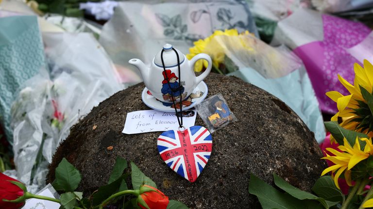Flowers and memorabilia are pictured at the gate, following the passing of Britain&#39;s Queen Elizabeth, at the Sandringham Estate in eastern England, Britain, September 11, 2022. REUTERS/David Klein
