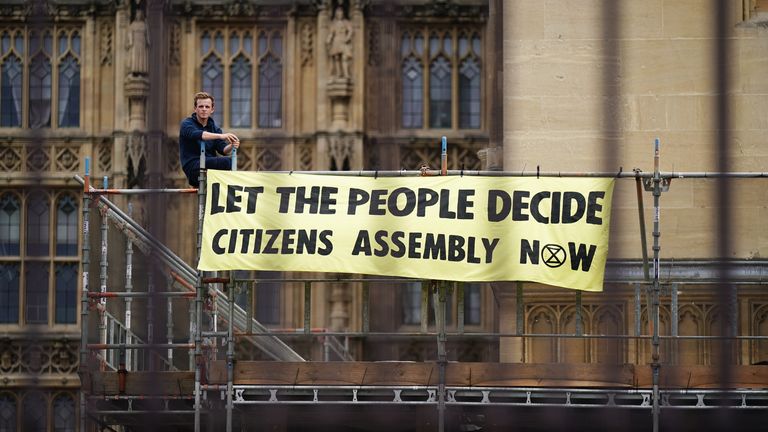 Demonstration of protesters against the extinction uprising on scaffolding erected for renovation work, outside at home of Parliament, Westminster, challenge for assembly of citizens. campaign group says    supporters have also glued to the speaker's chair in house of The House of Commons.  Photo date: Friday, September 2, 2022
