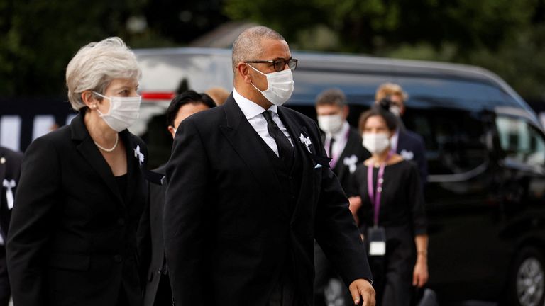 Theresa May and James Cleverly arrive at funeral