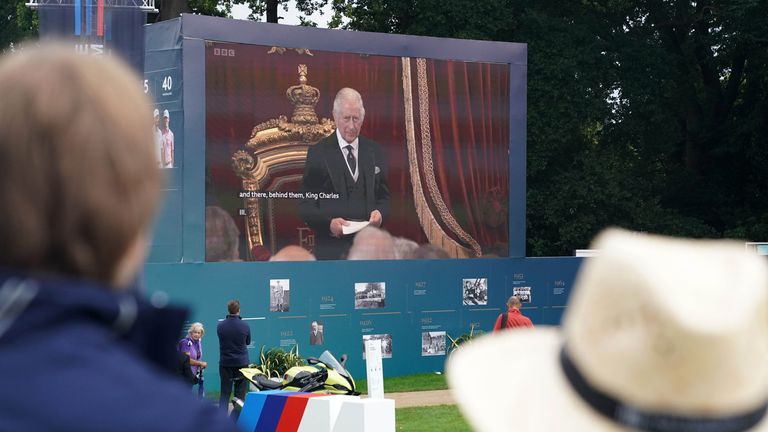 Spectators watch the Accession Council, where King Charles III is formally proclaimed monarch, on the big screen at Wentworth Golf Club, Virginia Water. Picture date: Saturday September 10, 2022.