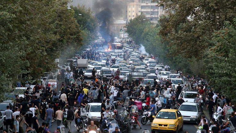 Protesters chant slogans during a protest over the death of a woman who was detained by the morality police, in downtown Tehran, Iran
PIC:AP