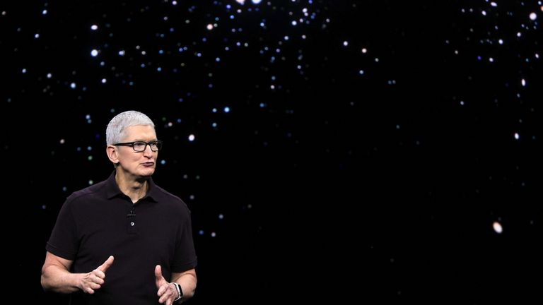 Apple CEO Tim Cook presents the new iPhone 14 at an Apple event at their headquarters in Cupertino, California, U.S. September 7, 2022. REUTERS/Carlos Barria