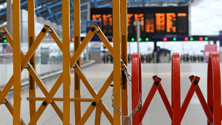 A chain and lock are seen on temporary closure barriers as rail workers in Britain strike over pay and terms, at Waterloo Station in London, Britain, August 18, 2022. REUTERS/Toby Melville