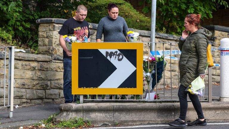 Floral tributes being left near the scene in Woodhouse Hill, Huddersfield, where a 15-year-old boy was stabbed and later died in hospital on Wednesday. Picture date: Thursday September 22, 2022.
