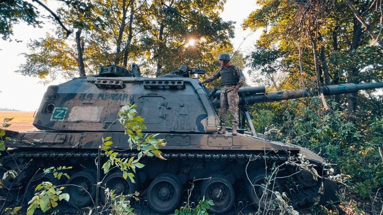 FILE PHOTO: A Ukrainian service member stands on a Russian 2S19 Msta-S self-propelled howitzer captured during a counteroffensive operation, amid Russia&#39;s attack on Ukraine, in Kharkiv region, Ukraine, in this handout picture released September 12, 2022. Press service of the 25th Airborne Brigade of the Armed Forces of Ukraine/Handout via REUTERS ATTENTION EDITORS - THIS IMAGE HAS BEEN SUPPLIED BY A THIRD PARTY./File Photo