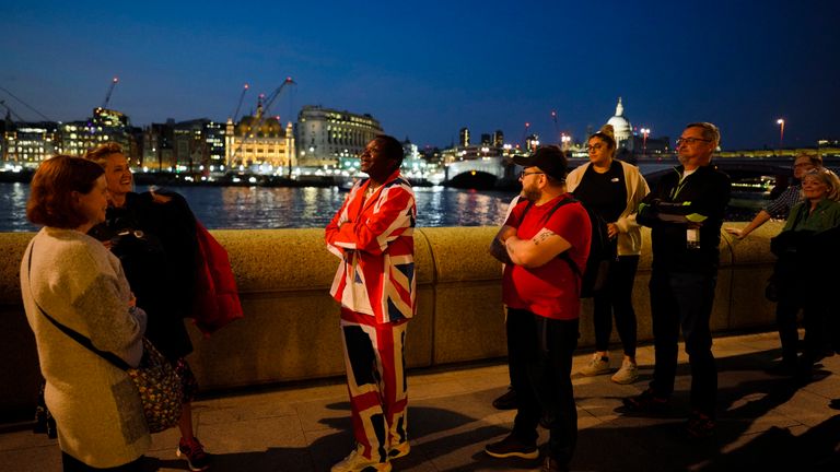 Henry, dressed with a &#39;Union Jack&#39; suit queues with other people to pay their respects to late Queen Elizabeth II. Pic: AP