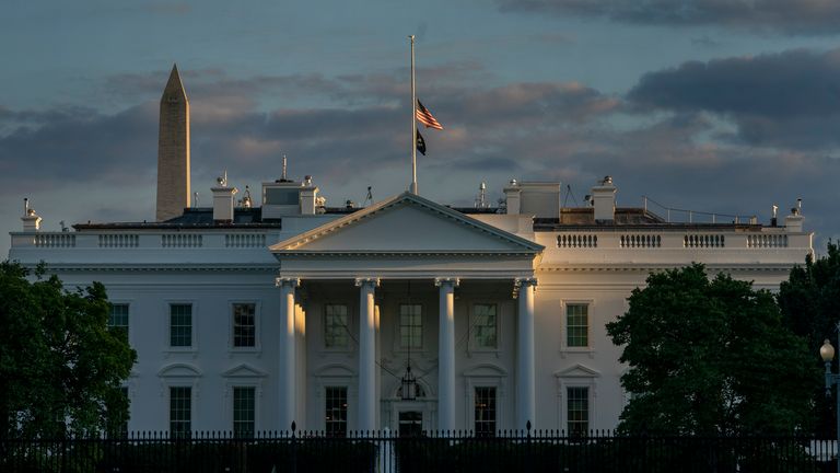 With the Washington Monument in the background, the American flag flies at half-staff over the White House. Pic: AP