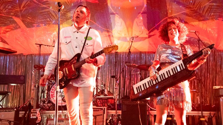 Win Butler, left, and Regine Chassagne of Arcade Fire perform at the Krewe du Kanaval Mardi Gras Ball at the Mahalia Jackson Theater for the Performing Arts on Friday, Feb. 14, 2020, in New Orleans.  (Photo by Amy Harris/Invision/AP)
