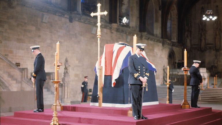 British Naval Officers stand vigil by the coffin of Sir Winston Churchill at Westminster Hall Pic: AP 