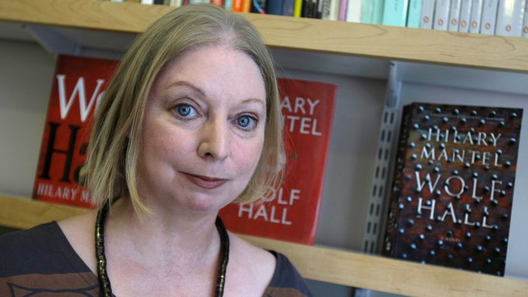 In this image taken on Thursday, Oct. 8, 2009 the winner of the 2009 Booker Prize for fiction Hilary Mantel with her book " Wolf Hall " poses for a photograph following an interview in London
PIC:AP