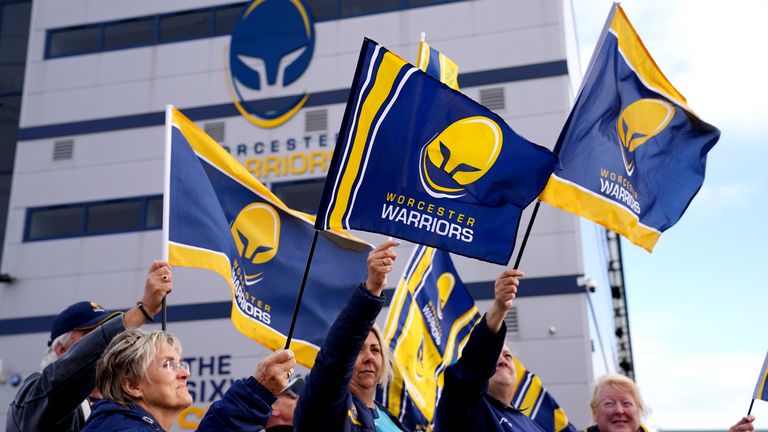 Worcester Warriors fans wave flags outside of Sixways Stadium, home of Worcester Warriors Rugby Club. Picture date: Monday September 26, 2022. Worcester have been suspended from all competitions after failing to meet the Rugby Football Union&#39;s 5pm deadline "to evidence insurance cover, availability of funds to meet the monthly payroll, and a credible plan to take the club forward", the governing body has announced. See PA Story RUGBYU Worcester. Photo credit should read: David Davies/PA Wire. RE