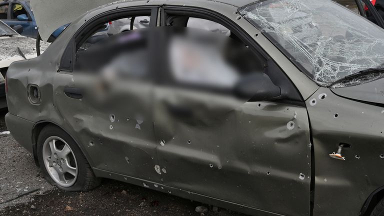  SENSITIVE MATERIAL. THIS IMAGE MAY OFFEND OR DISTURB    The body of a person killed by a Russian missile strike, that hit a convoy of civilian vehicles amid Russia..s attack on Ukraine, is seen inside a car in Zaporizhzhia, Ukraine September 30, 2022.  REUTERS/Stringer 
