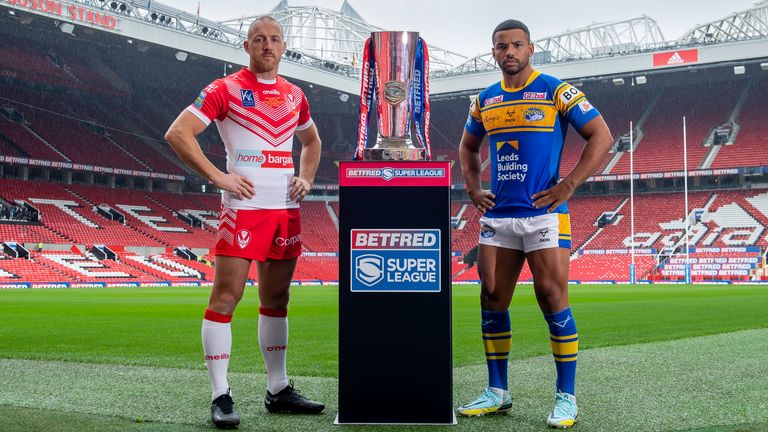 Picture by Allan McKenzie/SWpix.com - 22/09/2022 - Rugby League - Betfred Super League - Betfred Super League Grand Final Preview - Old Trafford, Manchester, England - St Helens&#39;s & Leeds&#39;s captains James Roby & Kruise Leeming on the field at Old Trafford with the Betfred Super League Trophy.