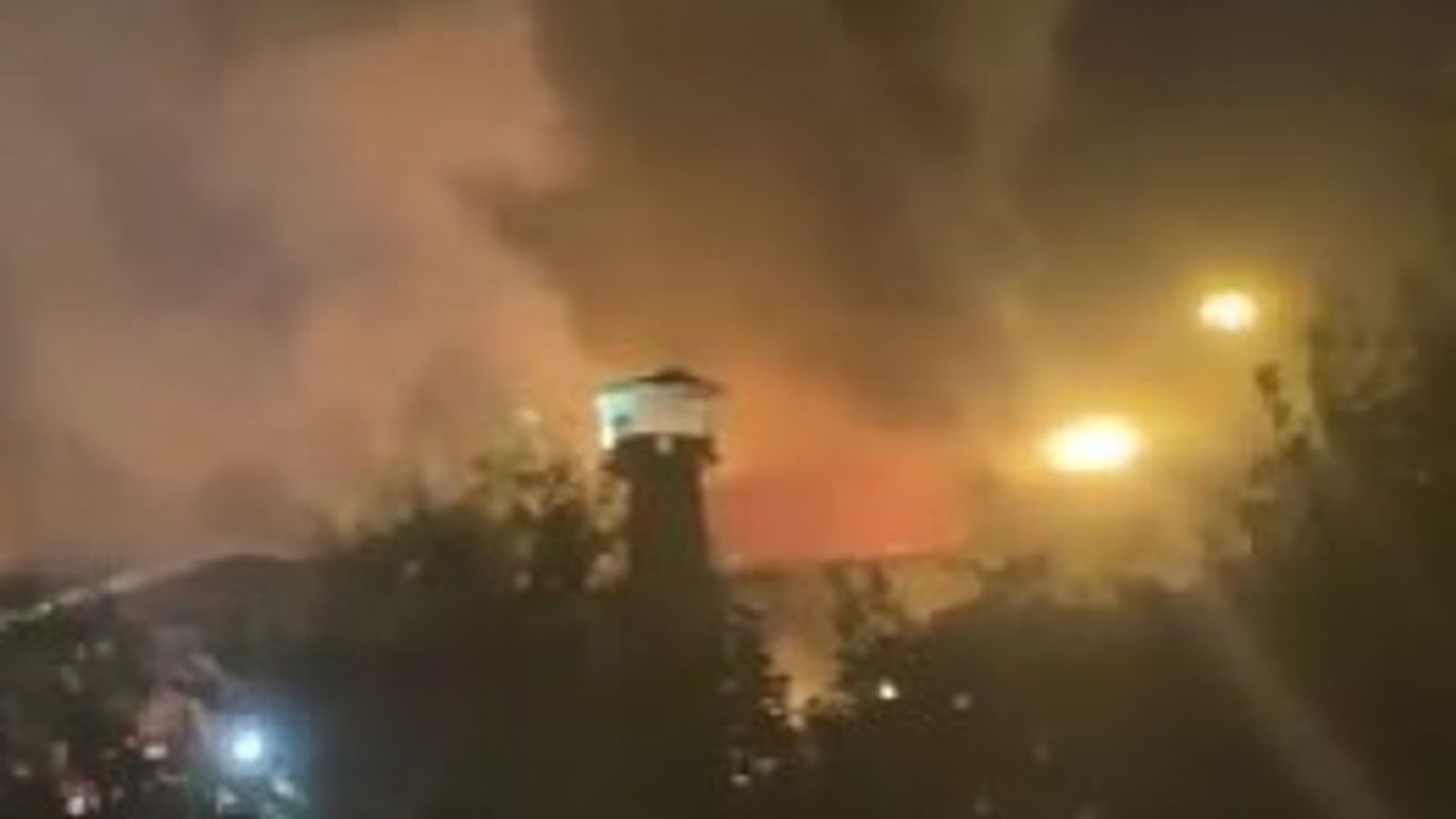 Four prisoners dead and dozens injured after huge fire breaks out at Iran's notorious Evin prison