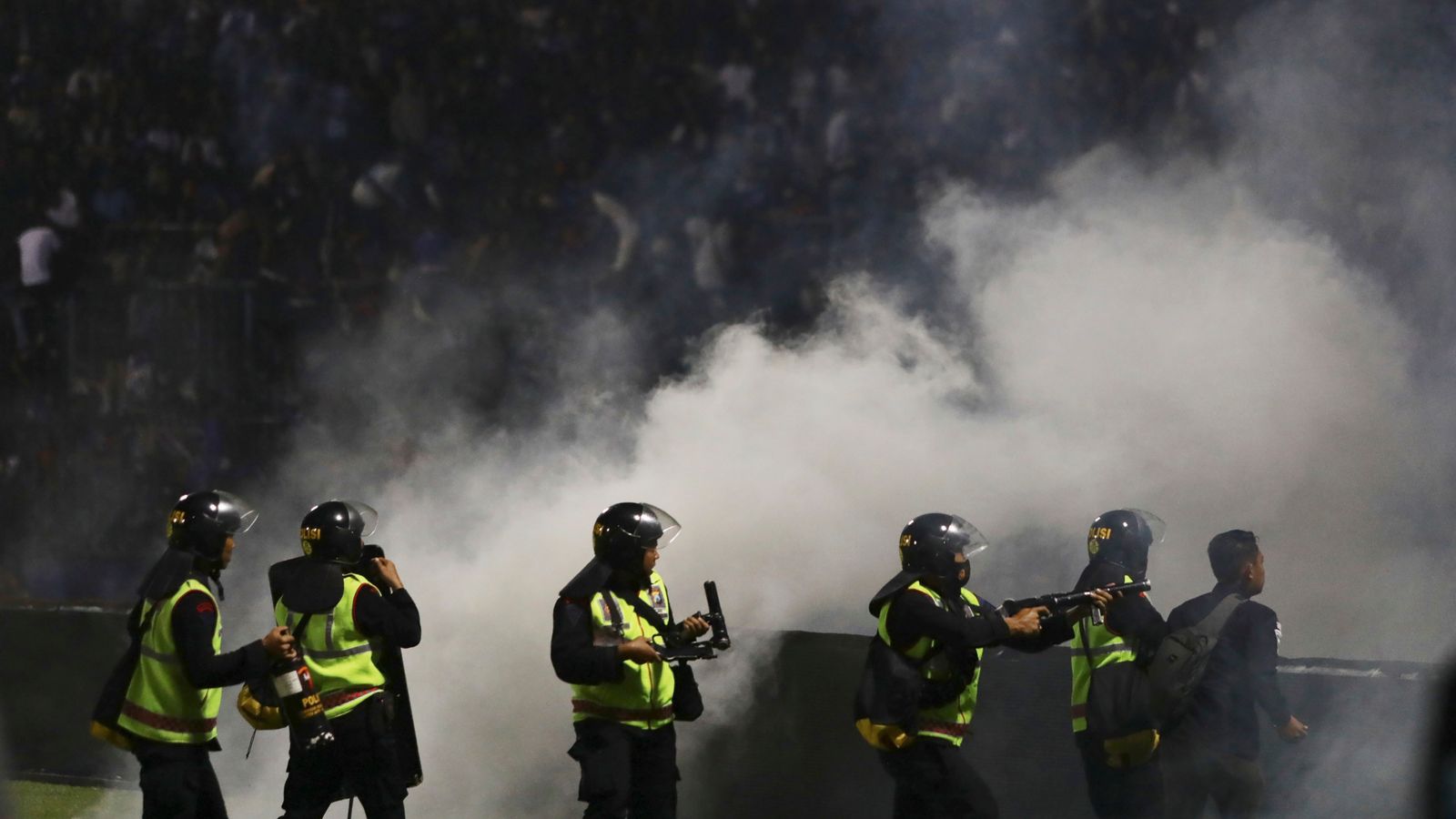 Police wrongly used tear gas at fatal Indonesian football match stampede, official says