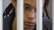  U.S. basketball player Brittney Griner, who was detained at Moscow's Sheremetyevo airport and later charged with illegal possession of cannabis, sits inside a defendants' cage before the court's verdict in Khimki outside Moscow, Russia August 4, 2022. REUTERS/Evgenia Novozhenina/Pool/File Photo