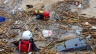 Rescue workers search submerged cars in Agia Pelagia Pic: AP