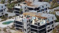 A damaged Fort Myers Beach apartment complex is seen from a U.S. Army National Guard helicopter as U.S. National Guard Bureau Chief General Daniel Hokanson tours the area by air after Hurricane Ian caused widespread destruction in Fort Myers Beach, Florida, U.S., October 1, 2022. REUTERS/Kevin Fogarty